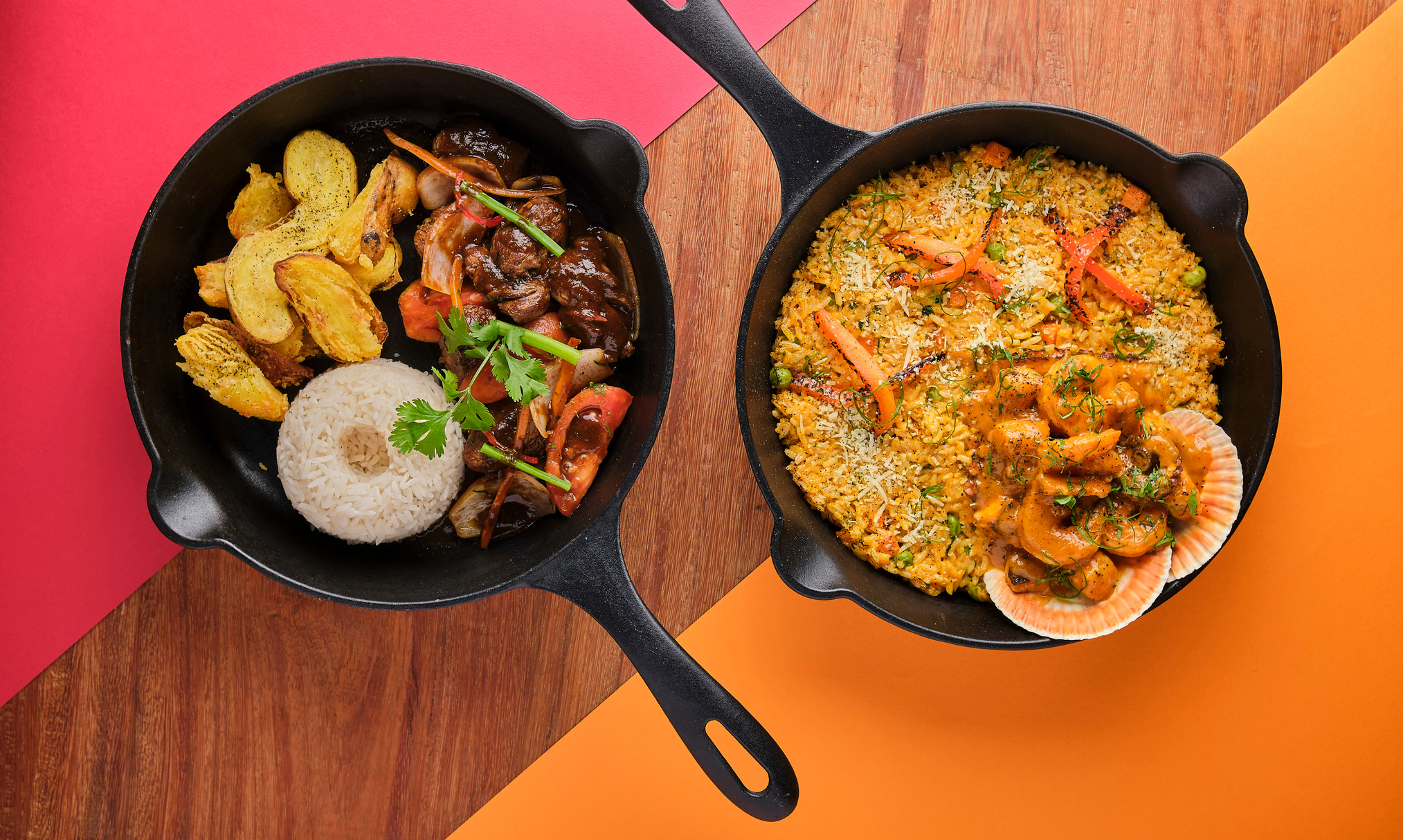 PERUVIAN FOOD: Rice with Seafood and Lomo Saltado, Typical Food of Peruvian Cuisine. Selective Focus